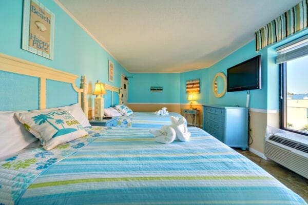Two blue beds in the bedroom