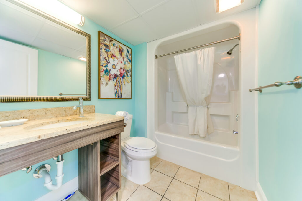 A white and teal colored Caravelle 518 bathroom