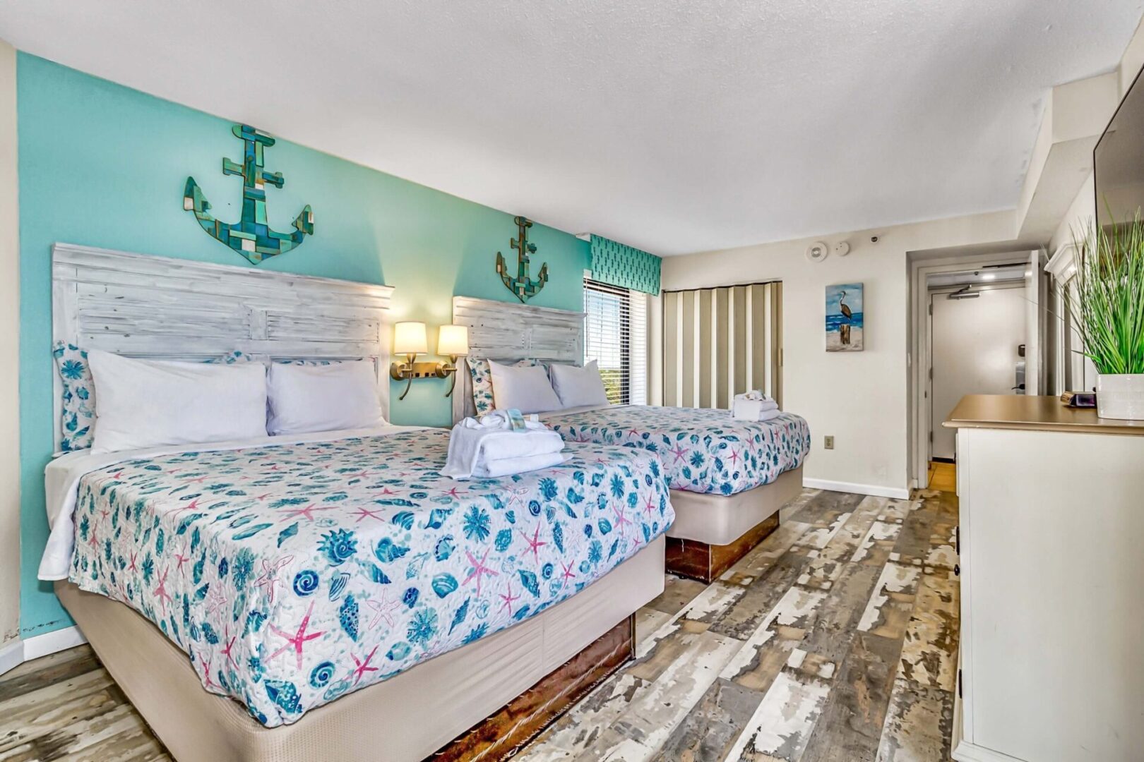 A picture double beds with anchor frames on the wall