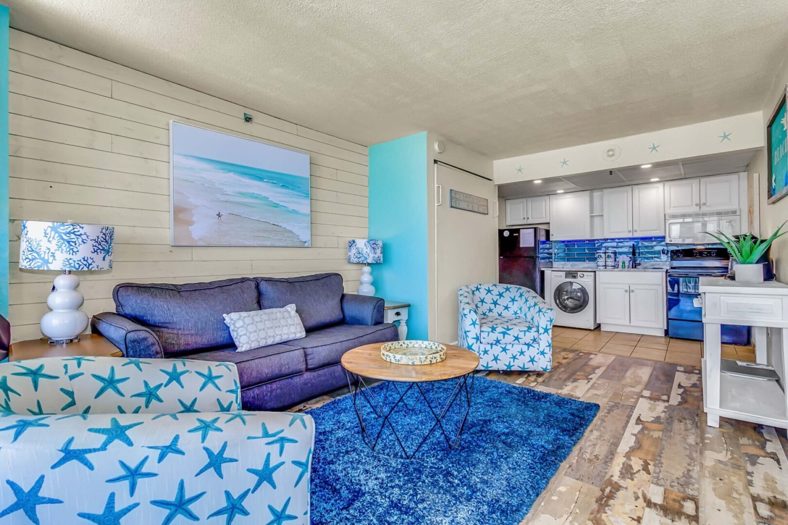 Blue colored furniture inside the pinnacle oceanfront house