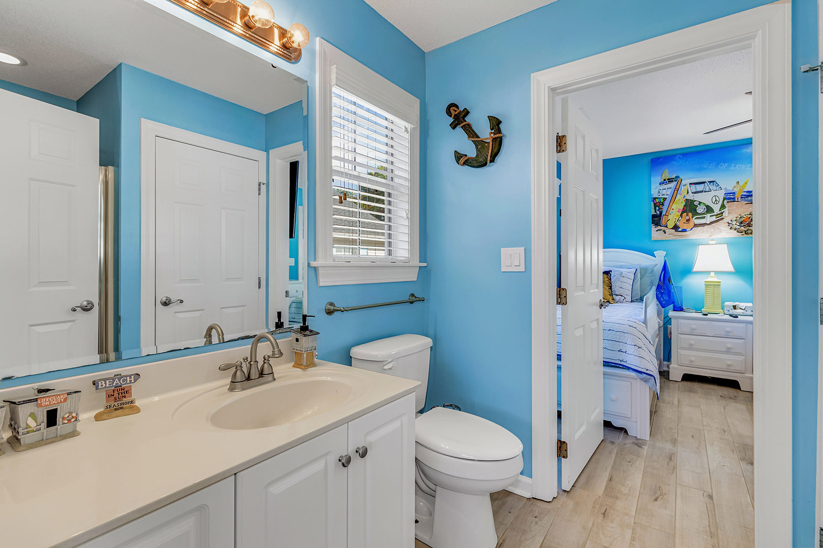 Bathroom with blue walls and white doors